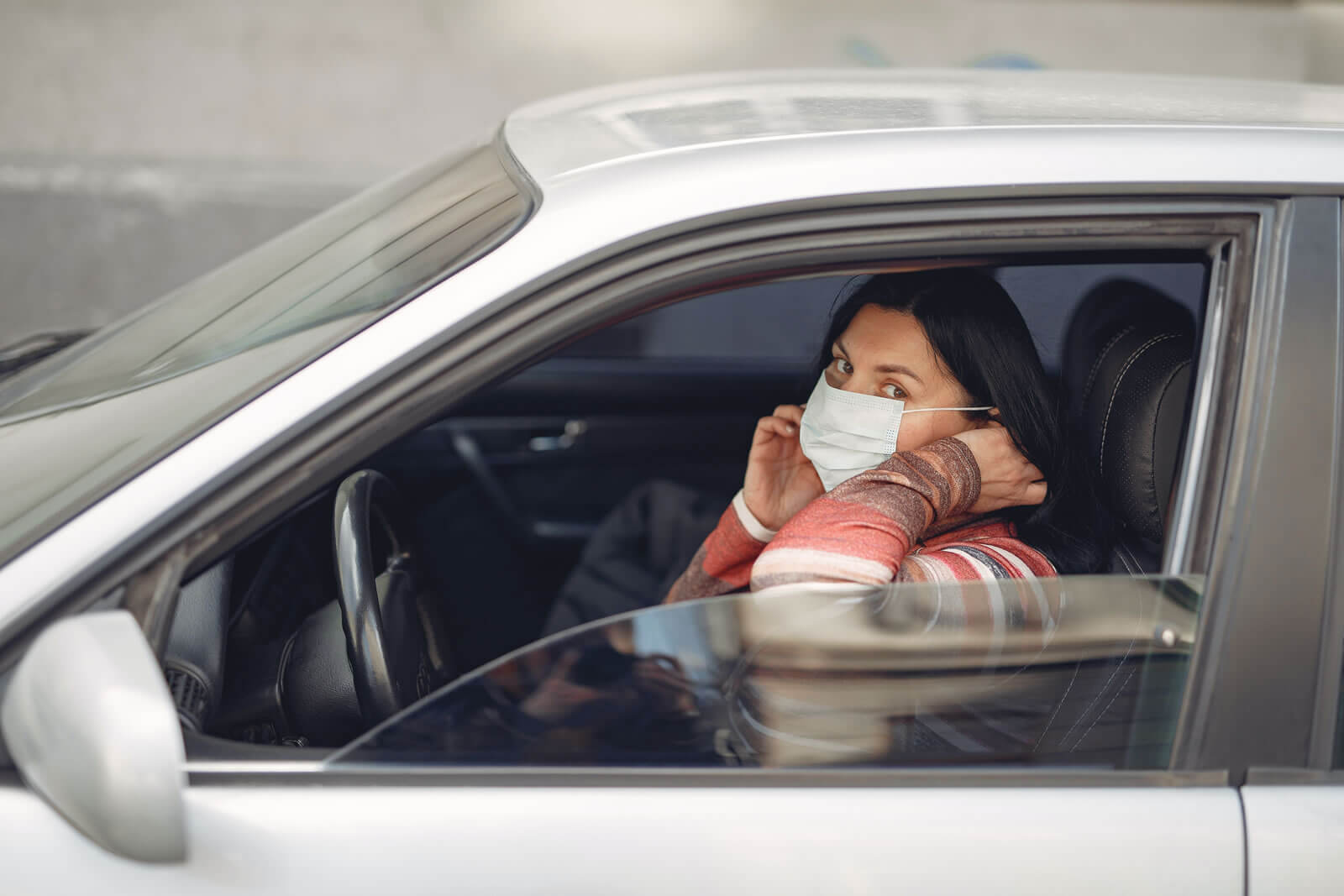 A woman wearing a protective face mask